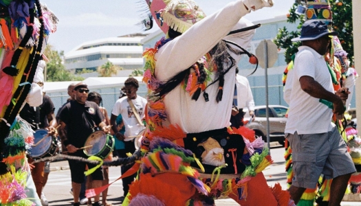Bermuda's Gombey dance troupes, decked out in colourful regalia, playing drums, beer-bottle fifes and tin whistles.